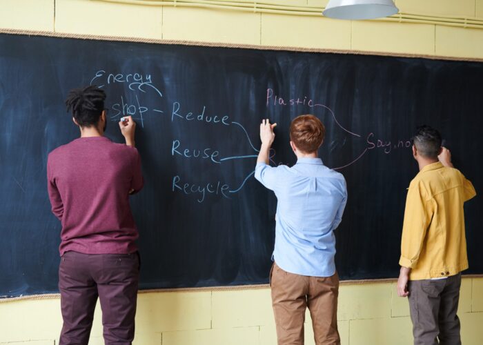 Canva – Men wriiting on Blackboard with Chalks Canva - Men wriiting on Blackboard with Chalks