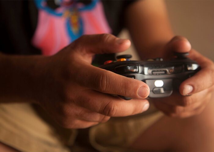 Tony Gonzalez plays a video game in his room on December 3, 2012 in Woodbridge, Virginia.  Gonzalez spends about an hour each night playing video games. (Photo/Deeana Garcia)